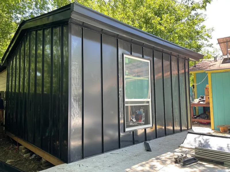 Black standing seam metal wall panels for Roof Inspection in Bloomer