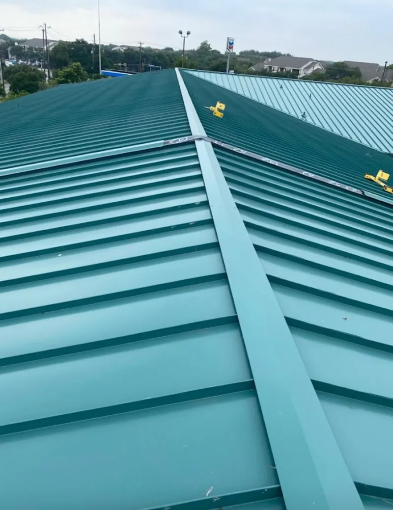 Green commercial metal roof ridge and valley for Metal Roof Repair in Bloomer
